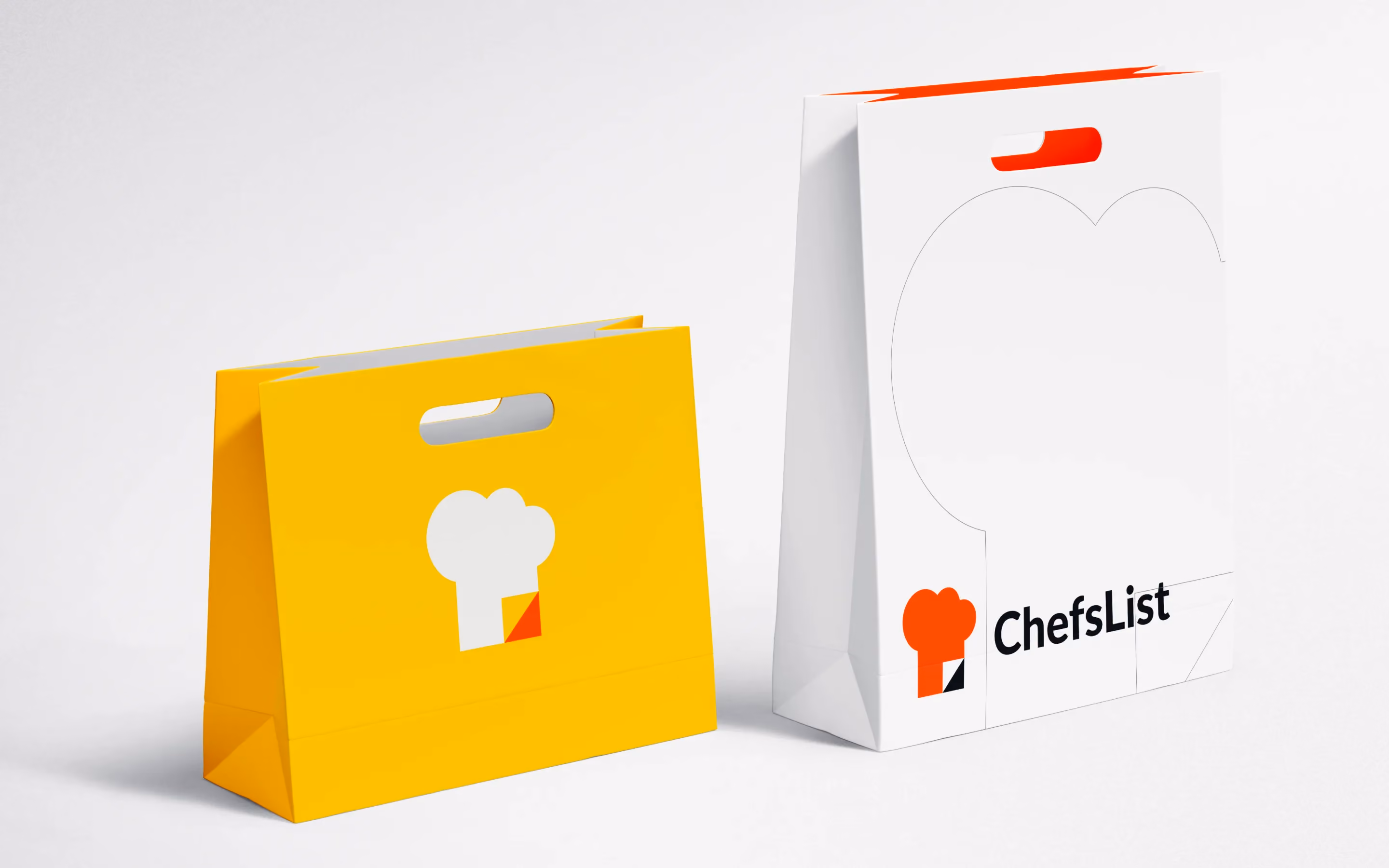 Minimalist branded paper bags for ChefsList with chef hat logo in yellow and white