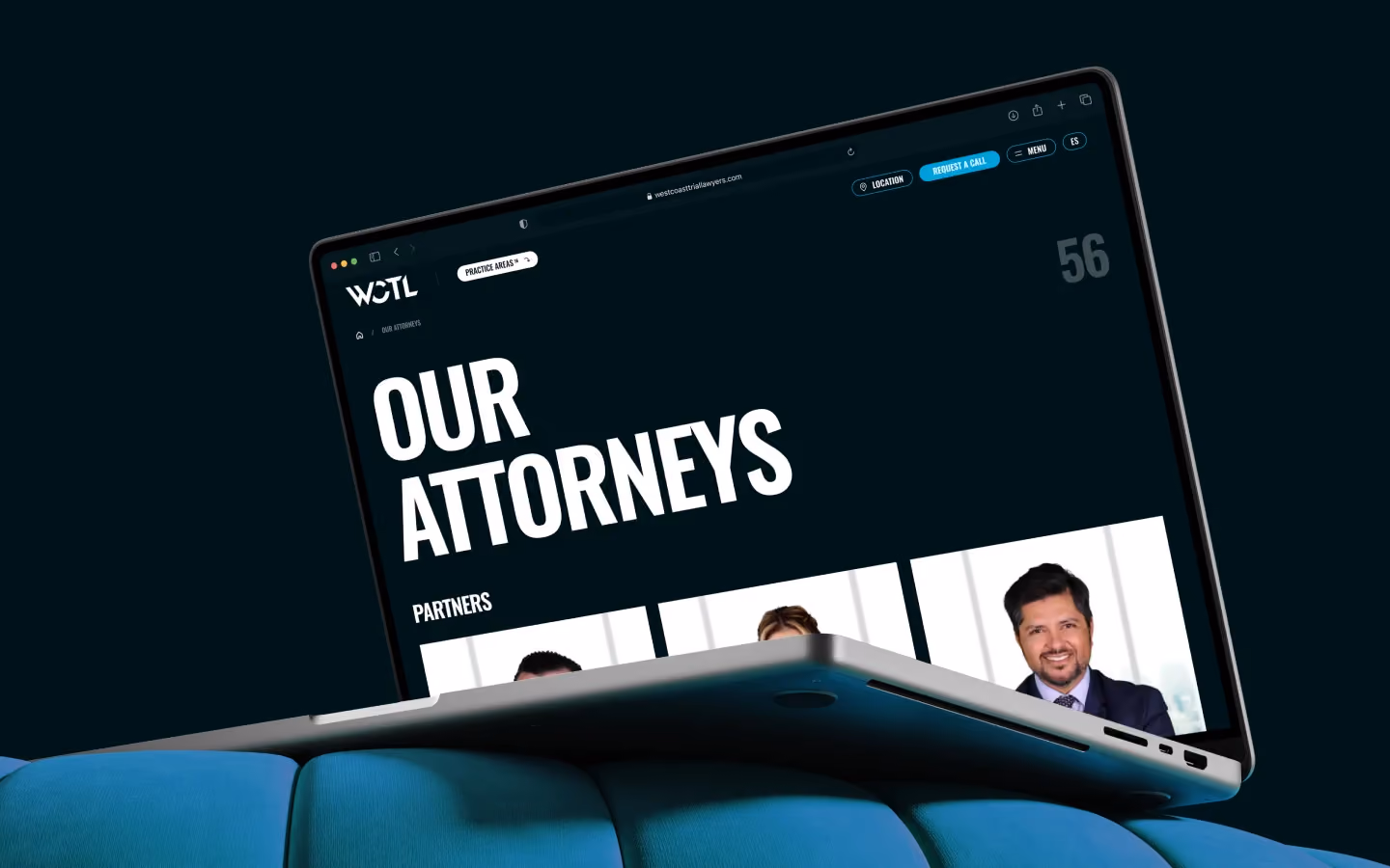 WCTL law firm website page on laptop displaying team member profiles under "Our Attorneys."