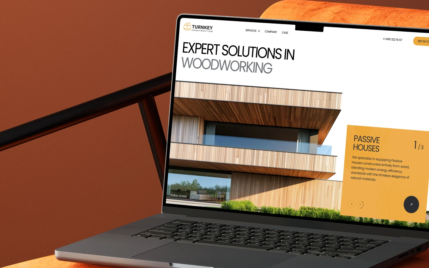 Website design for a woodworking company shown on a laptop screen, featuring a modern timber house with the headline “Expert Solutions in Woodworking.”