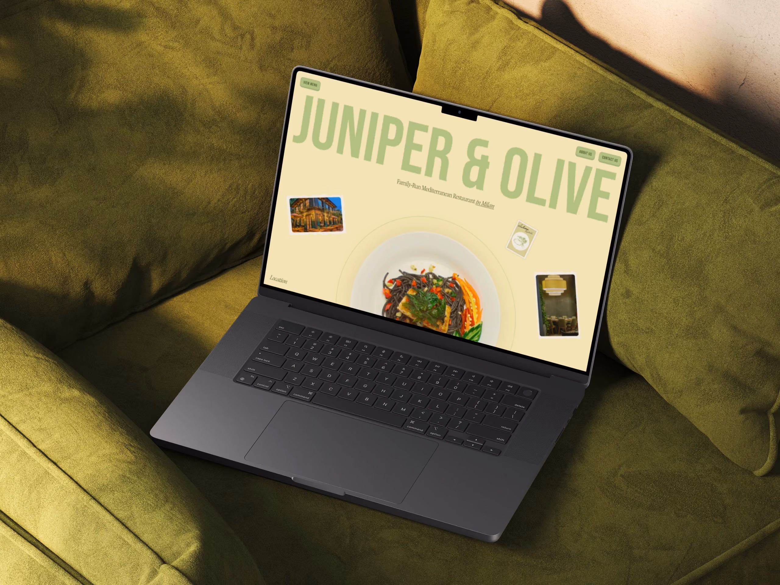 Restaurant website on laptop with playful typography and a Mediterranean dish in the center.