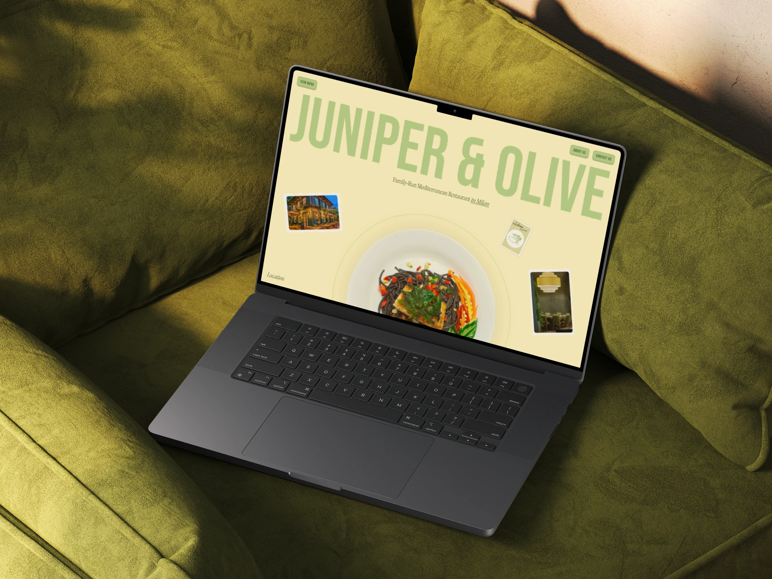Restaurant website on laptop with playful typography and a Mediterranean dish in the center.