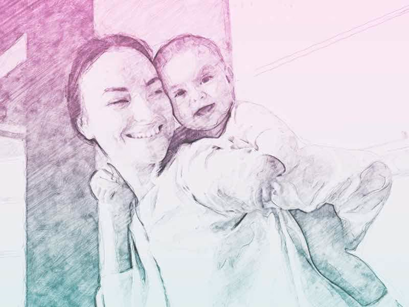 Young mother carries child on her back playfully