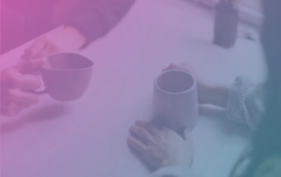 Two people have confidential conversation over the coffee cups