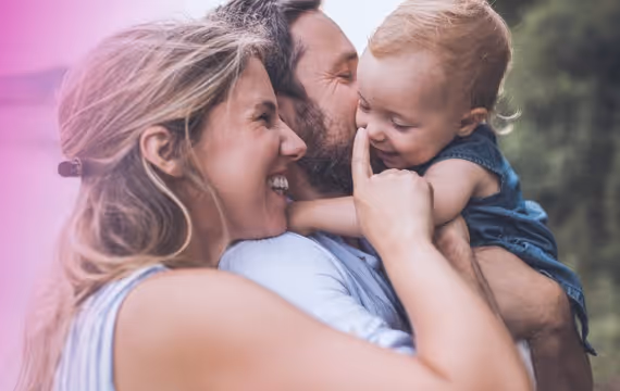 Couple with their baby in scenic surroundings