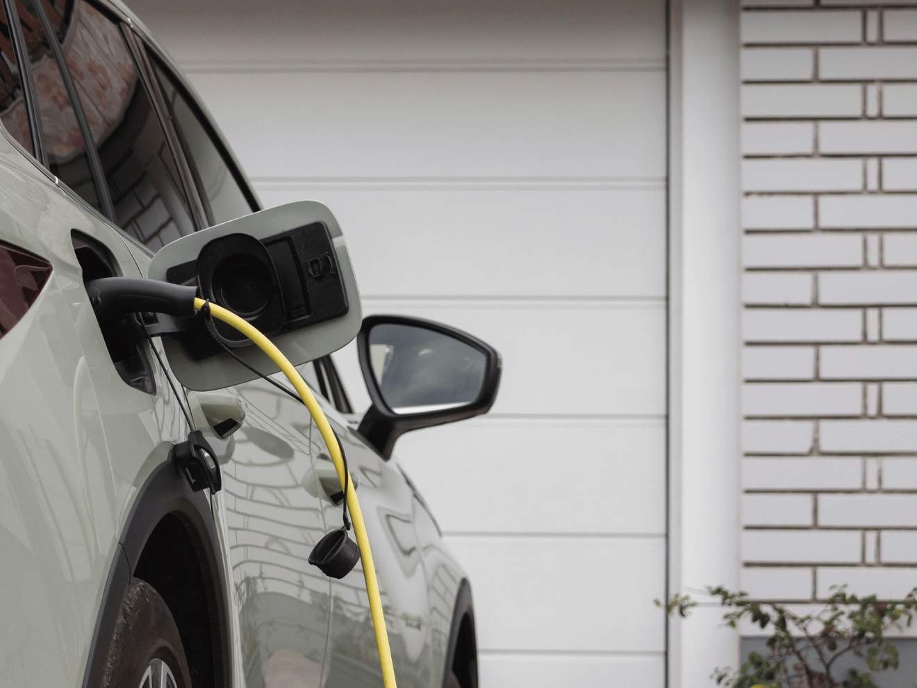 Ev charger station in the garage at home