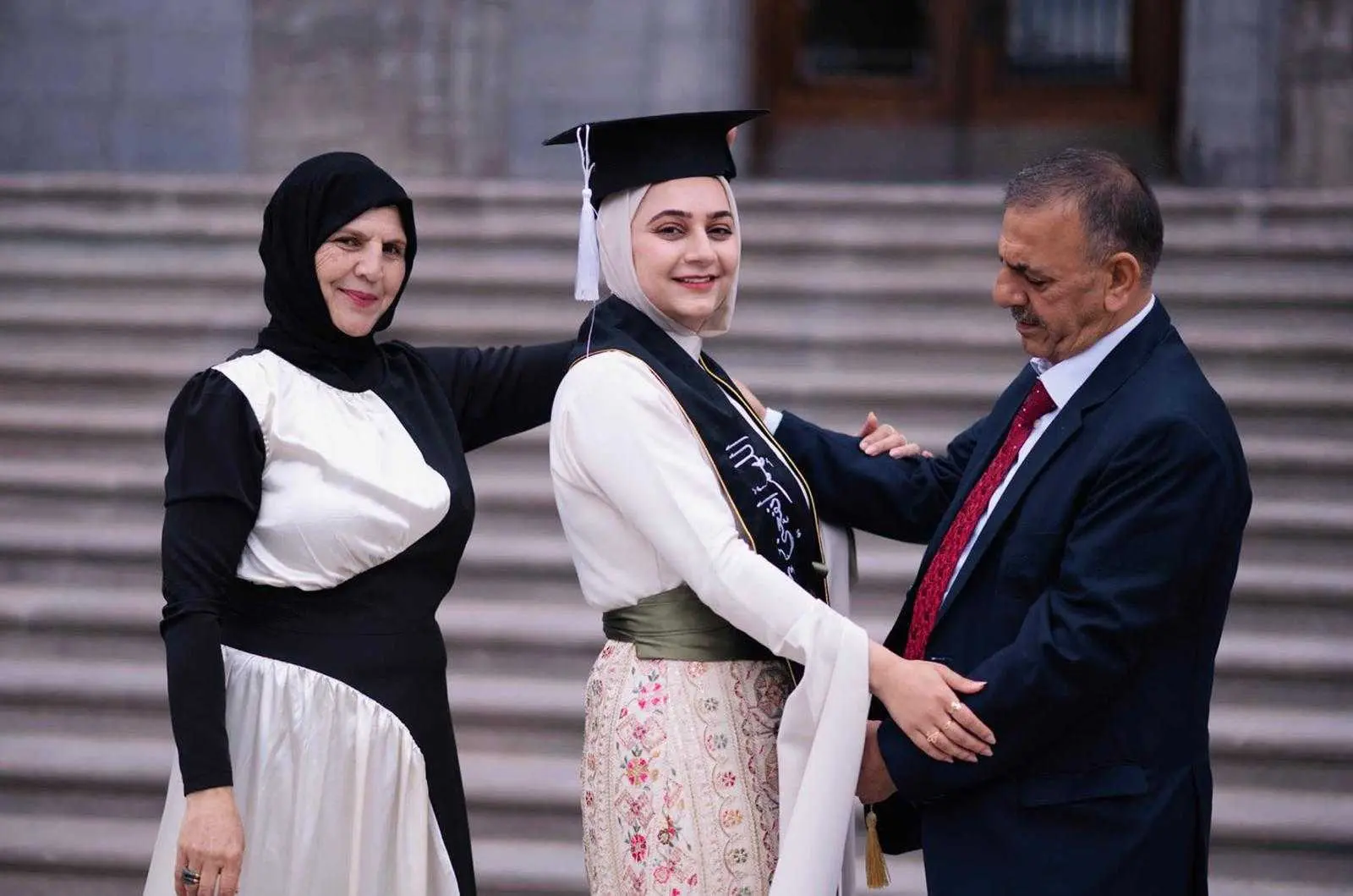 AlNachawati and parents at McGill Graduation