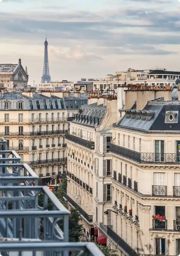 View of the Eiffel Tower and Paris rooftops, showcasing Airbnb management in France..