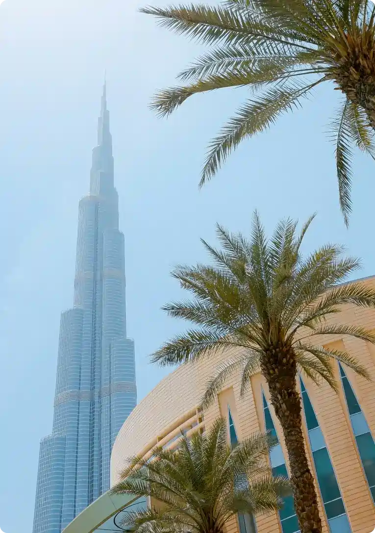 Palm trees and Burj Khalifa skyline illustrating Airbnb management in the UAE.