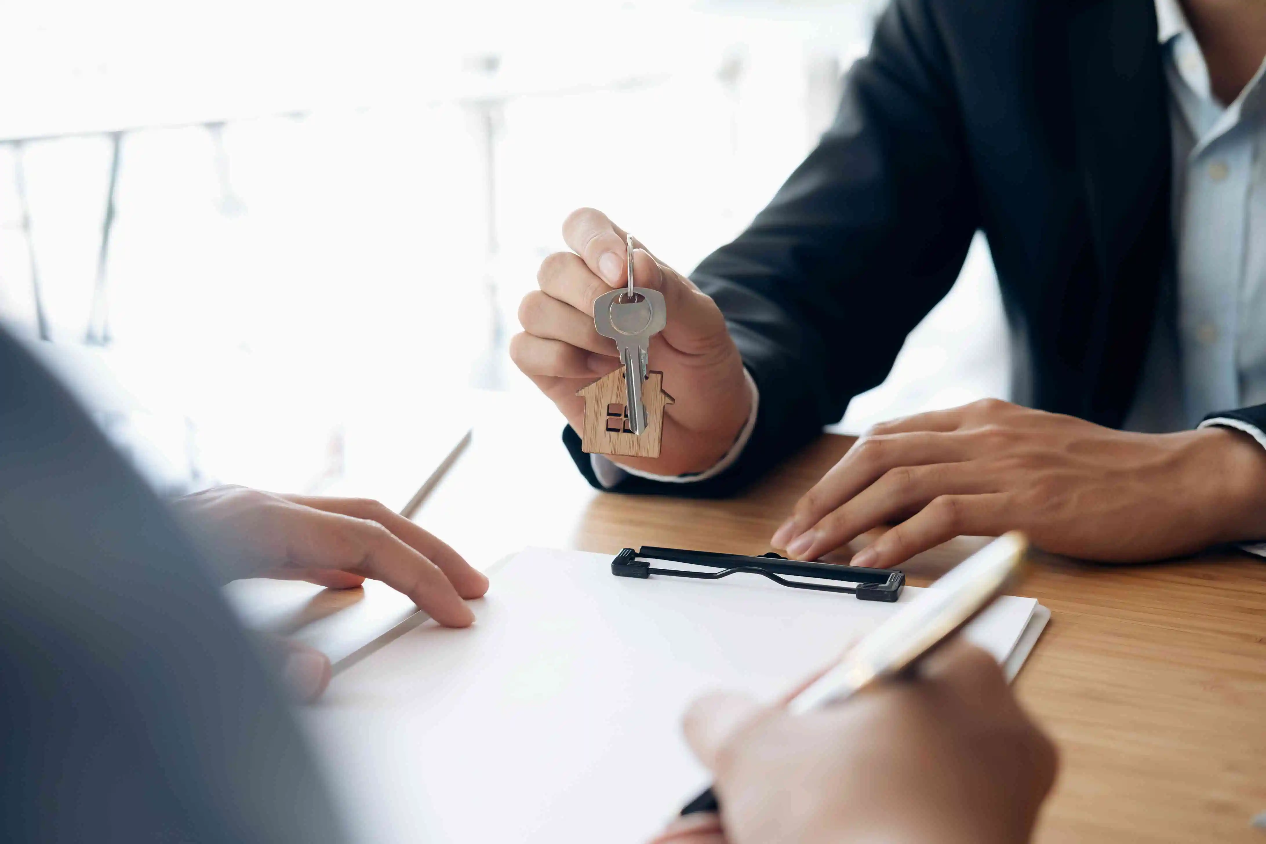 Lease agreement document and pen on a table, ready for signatures
