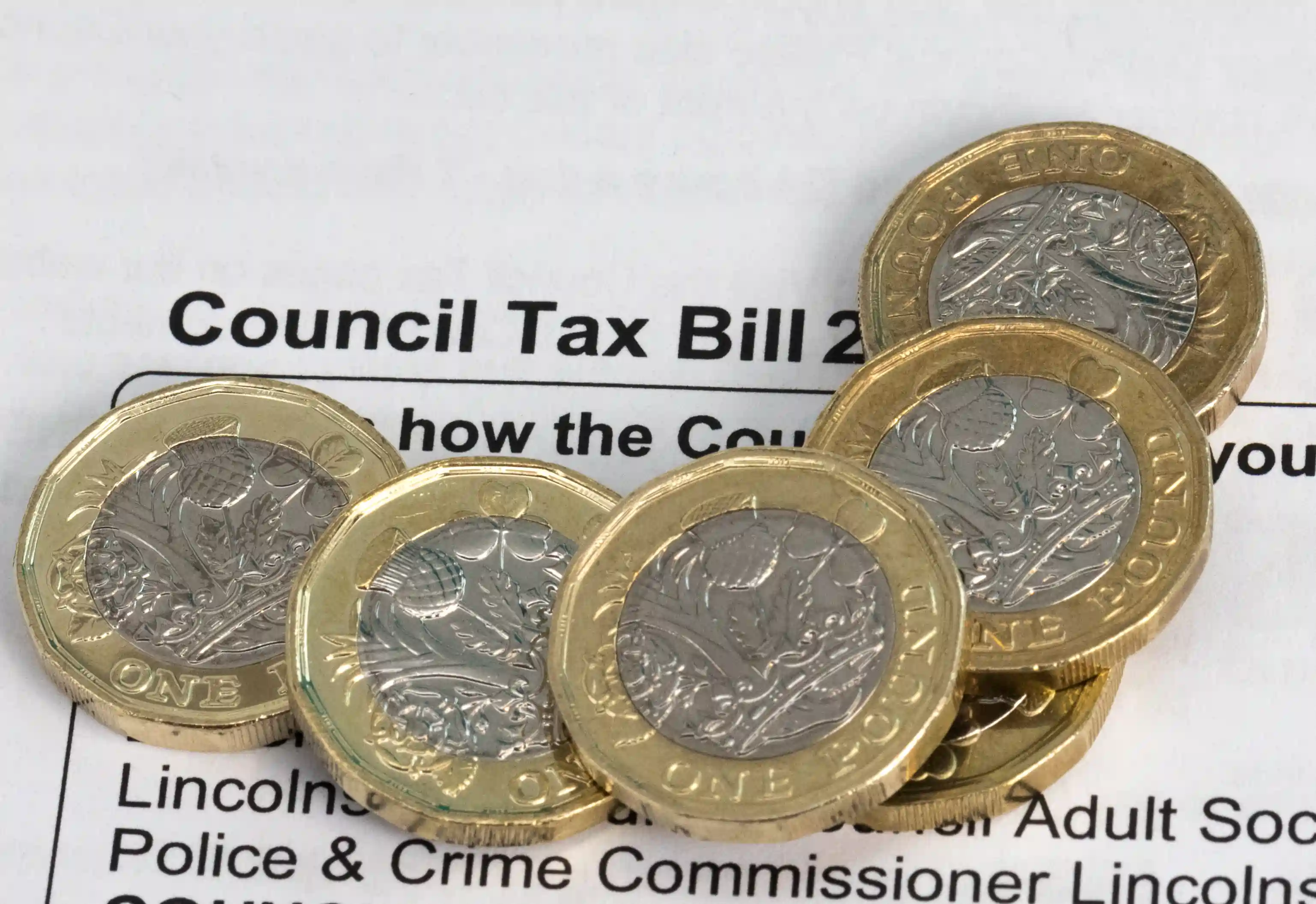 Close-up of a UK council tax bill with Airbnb logo overlay, illustrating tax obligations for short-term rental hosts.