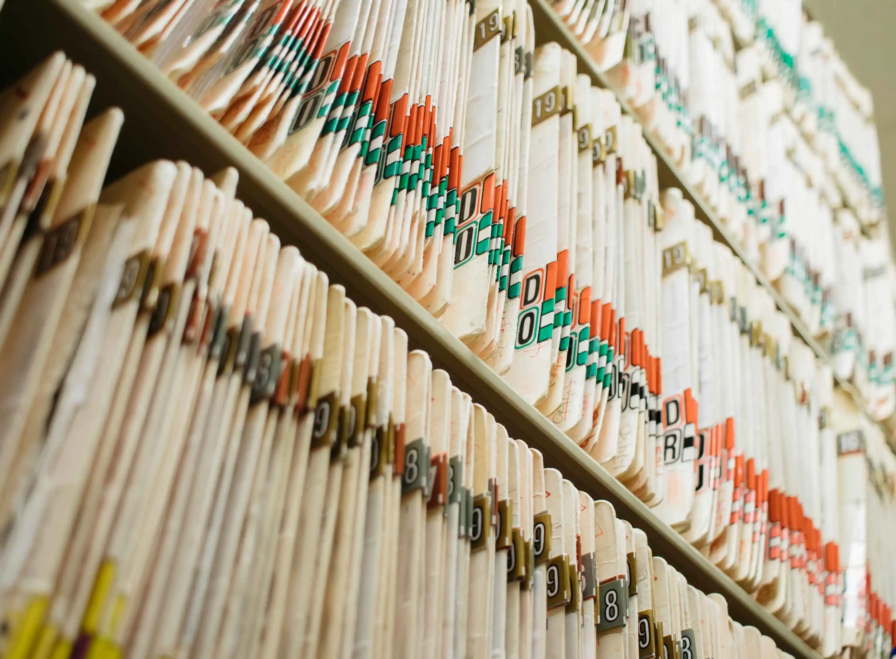 Close-up of organized folders and financial documents on a desk, highlighting the importance of record-keeping for rental income.