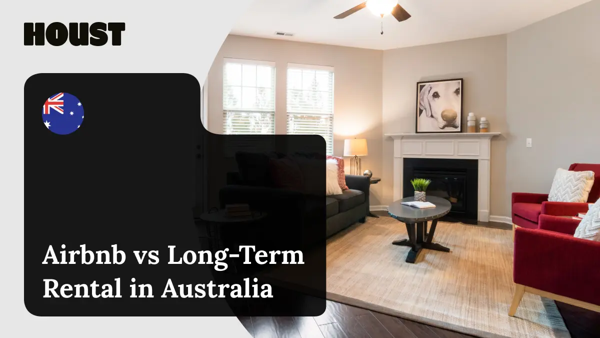 Furnished living room with a sofa, red armchairs and a fireplace, featured image for Houst's comparison of Airbnb and long-term rental in Australia