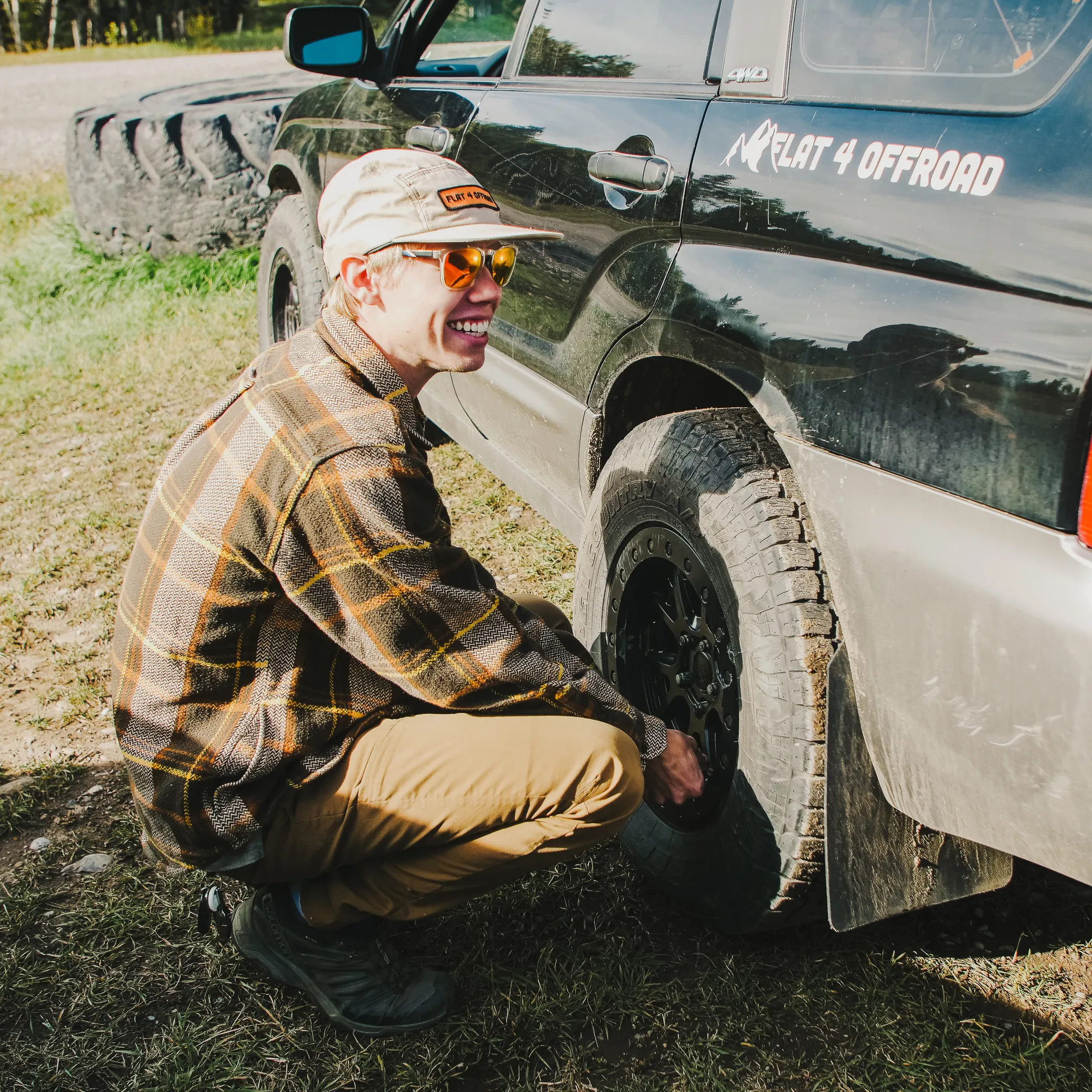 Chase Schrader the owner of Flat 4 Offroad airing down the tires on a 2004 Subaru Forester to go offroad