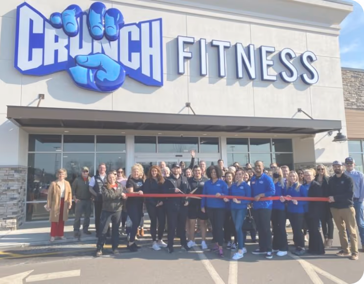 A smiling woman using a laptop
