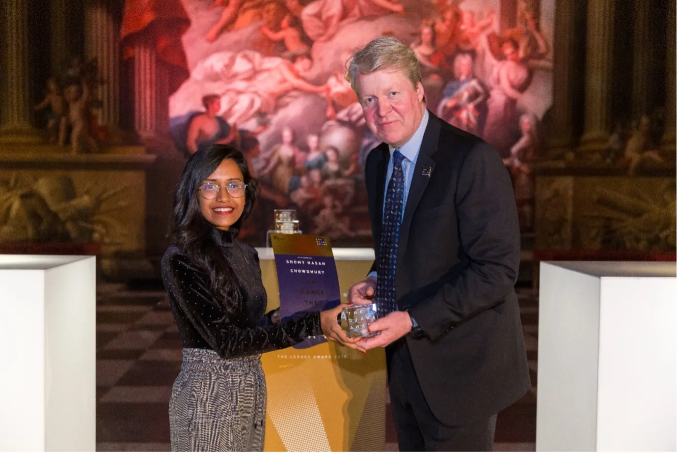  Shomy receiving her Legacy Award from Earl Spencer in 2019.