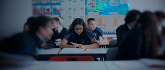 A group of students sitting at desksAI-generated content may be incorrect.