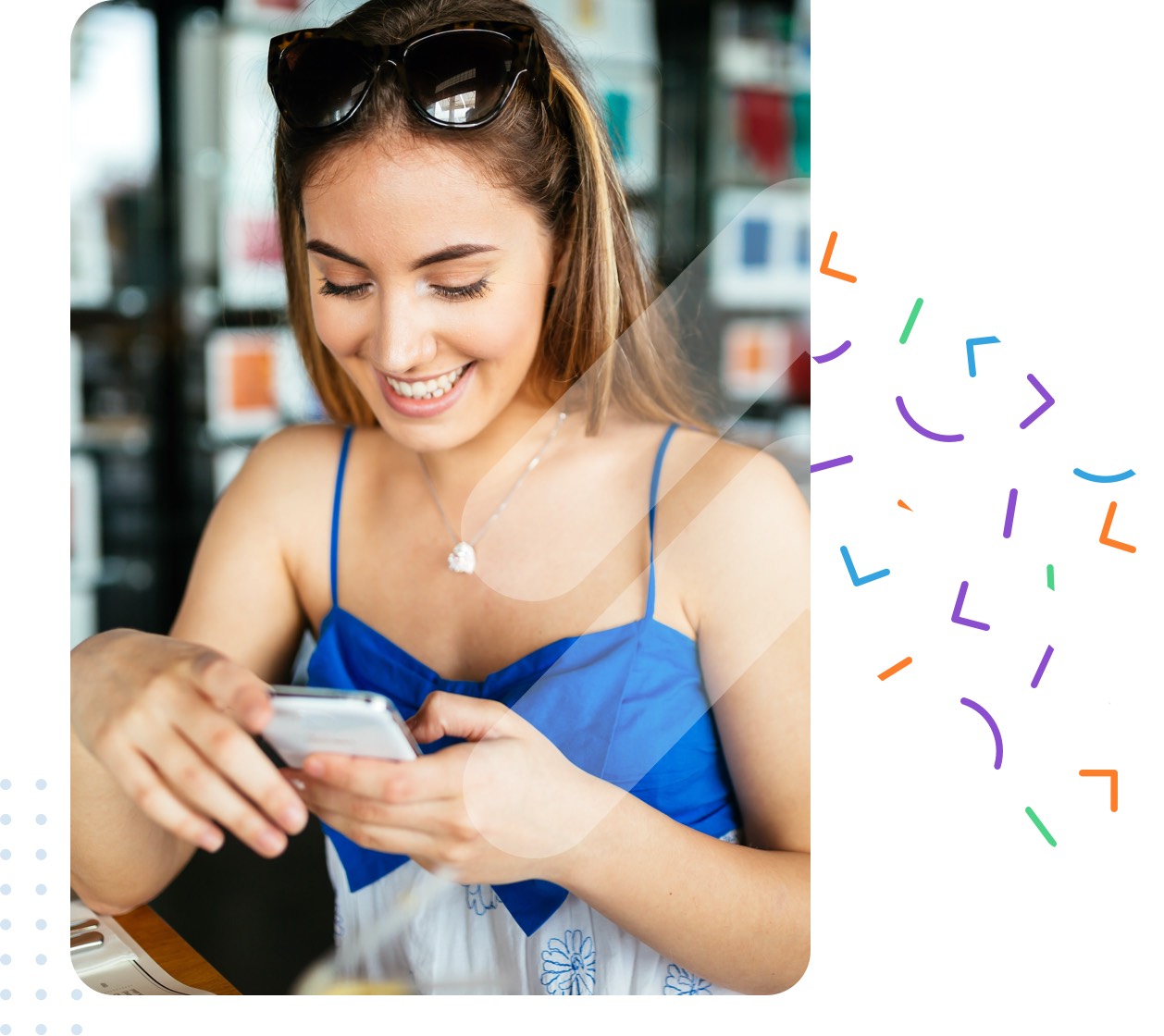 women smiling at her phone