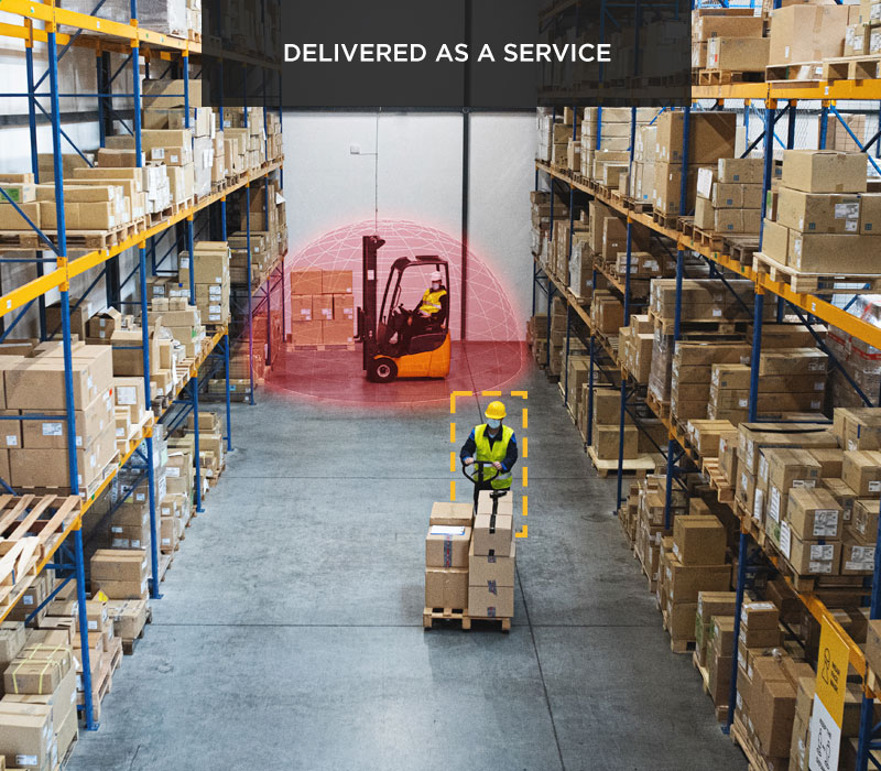An aisle in a warehouse with a worker and a forklift. The forklift has a SensorZone detection bubble superimposed around it.