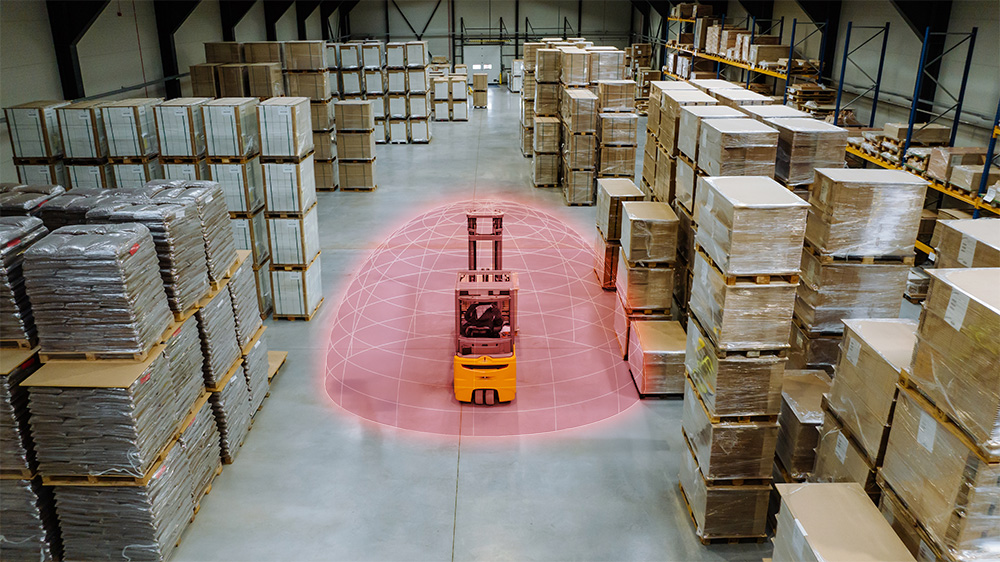 CAT construction roller with SensorZone proximity warning detection field visualised around the vehicle on a construction site