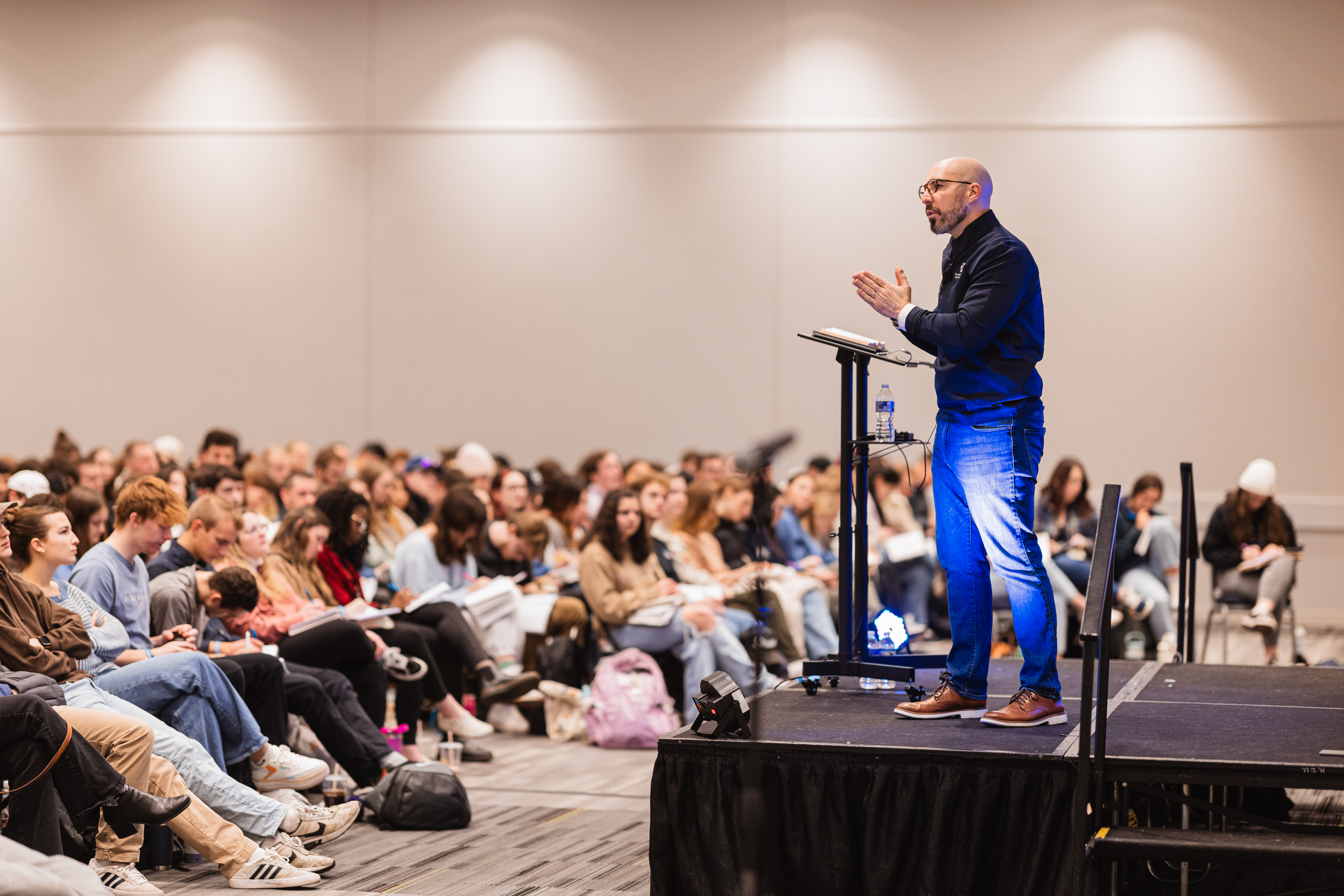 A speaker addressing the room at CROSS Con