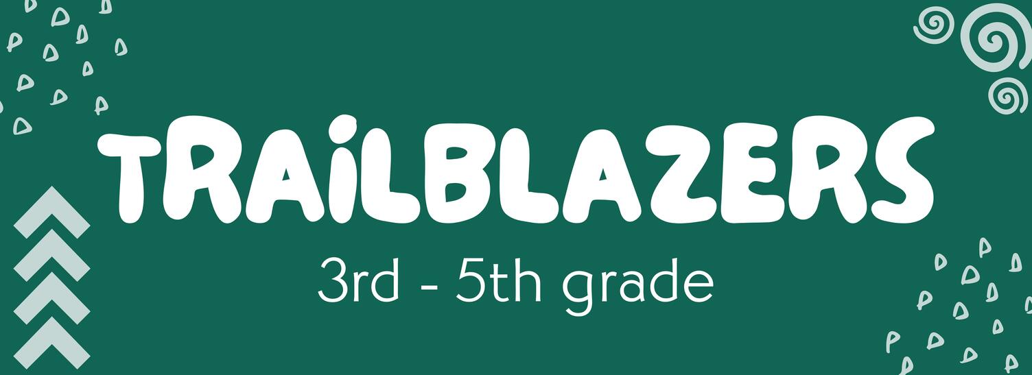 A woman helping 2 girls with their arts and crafts at a table.