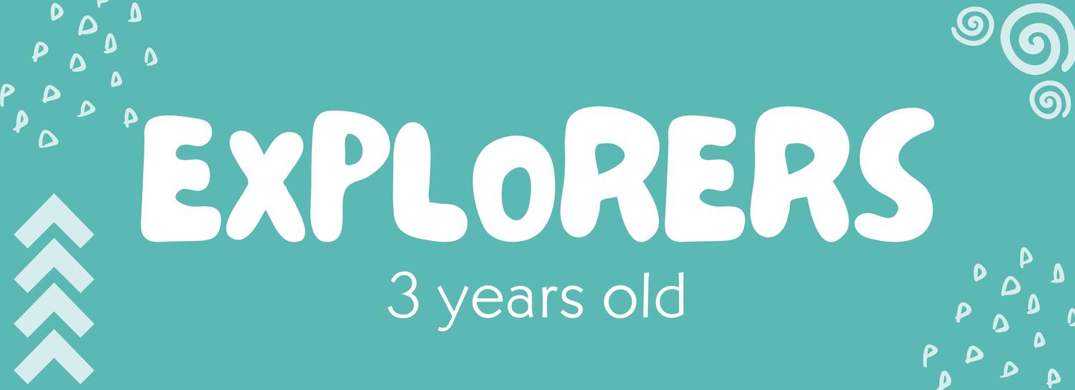 A woman helping 2 girls with their arts and crafts at a table.