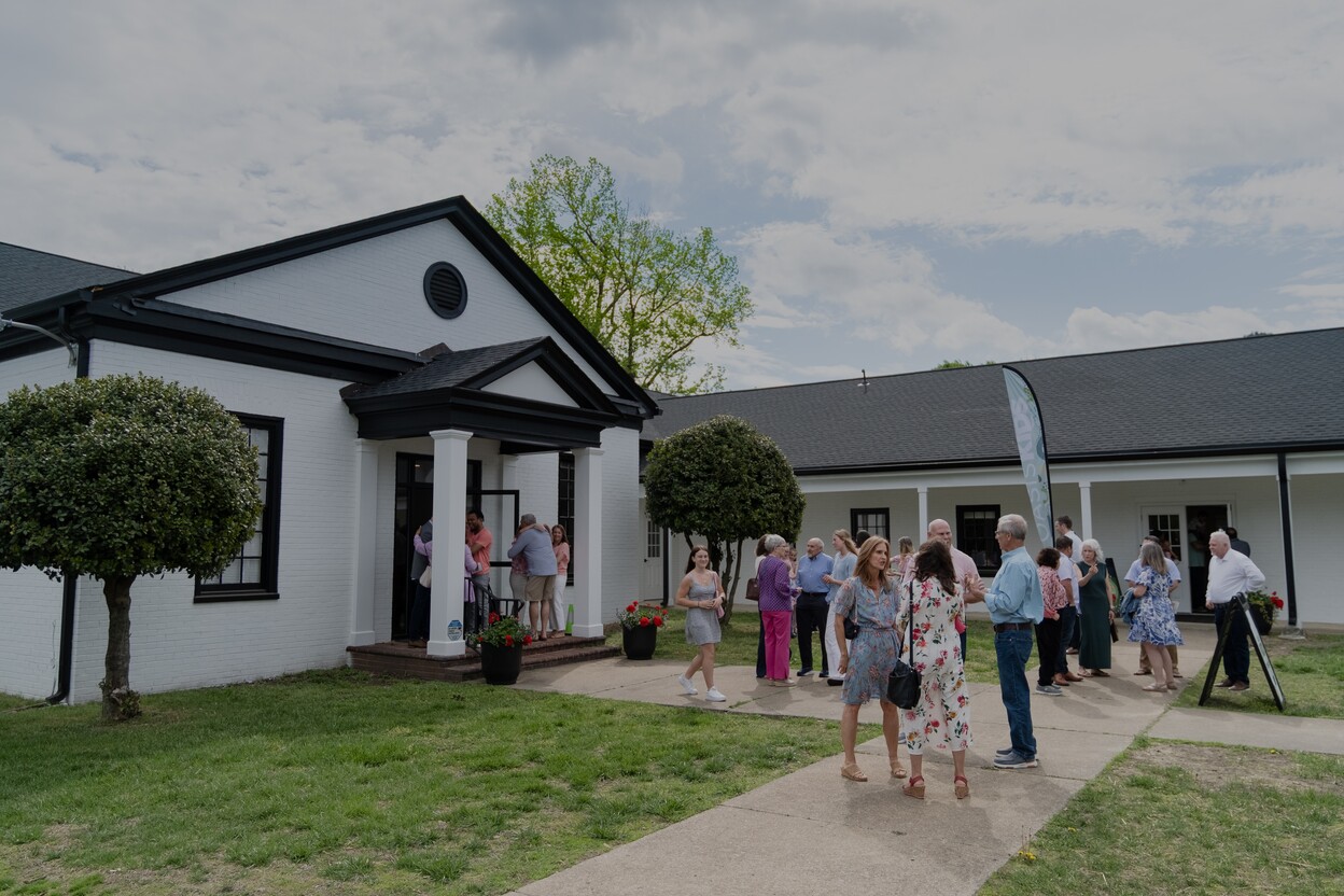 A group of people standing outside of Oasis Church.