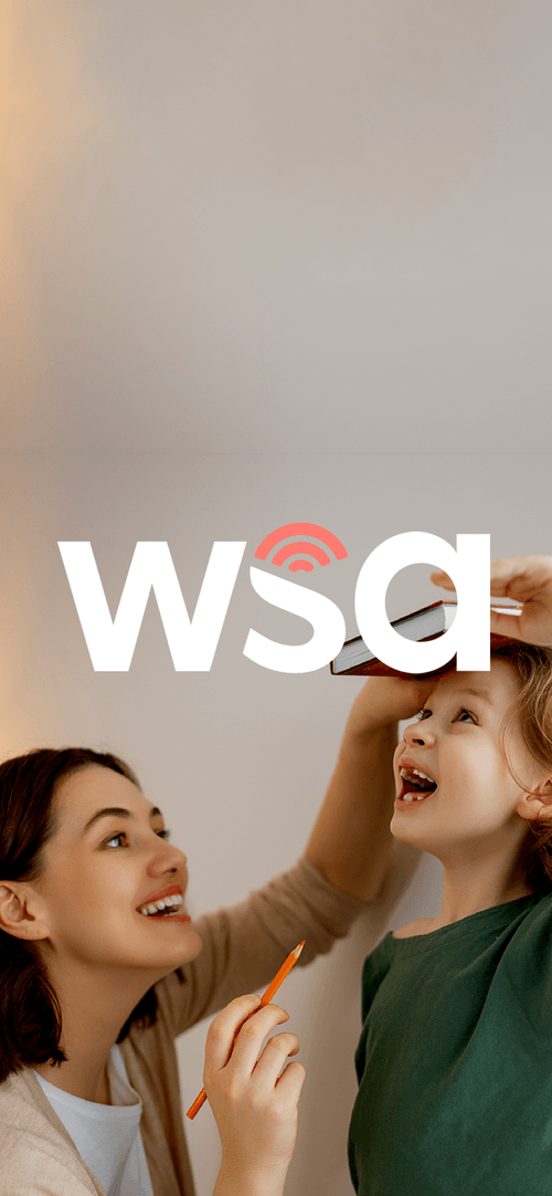 girls laughing with wsa logo in front