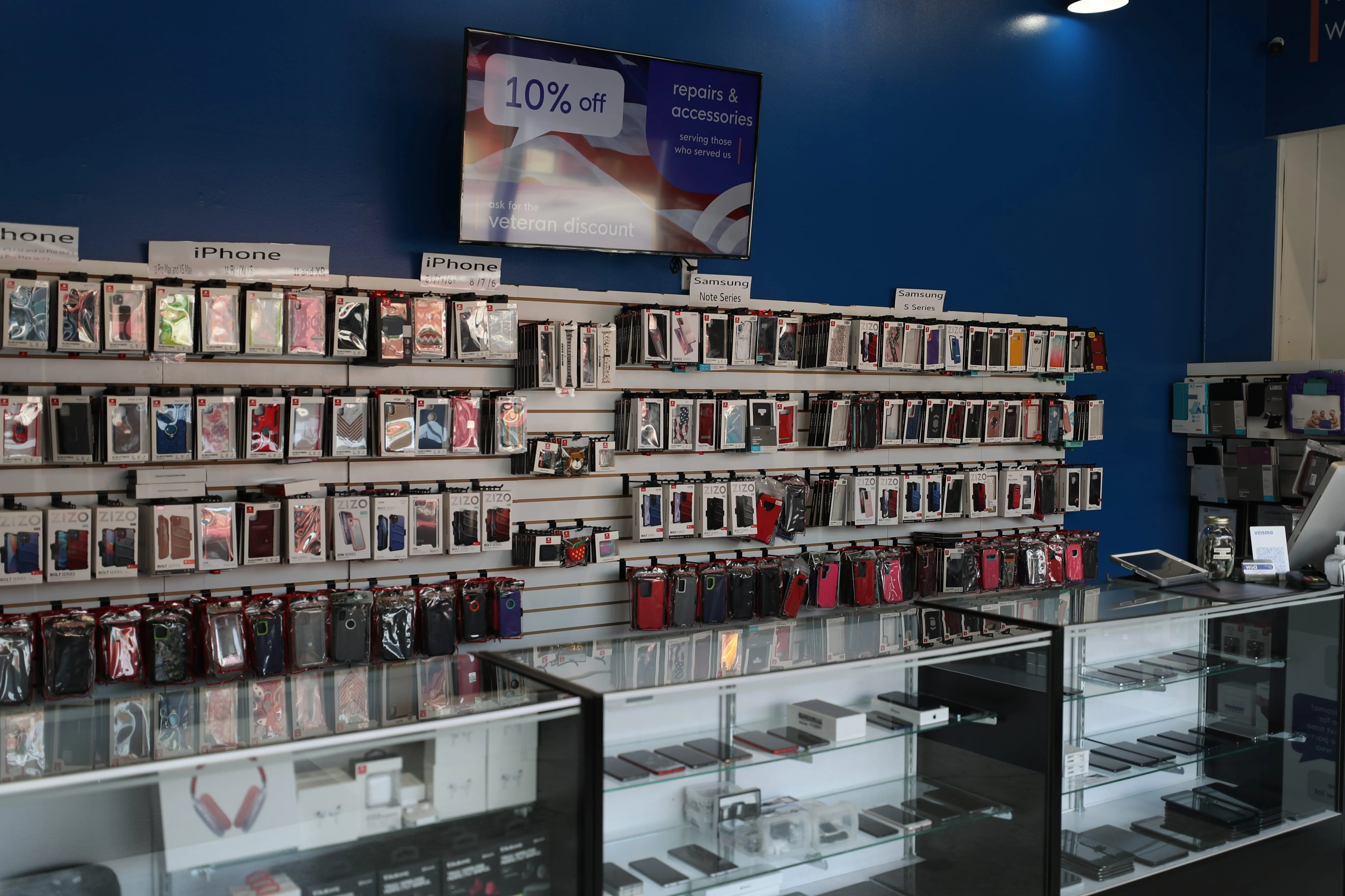 The cases, counters, and back wall of a WSA location showing their available phones, devices, and accessories for sale