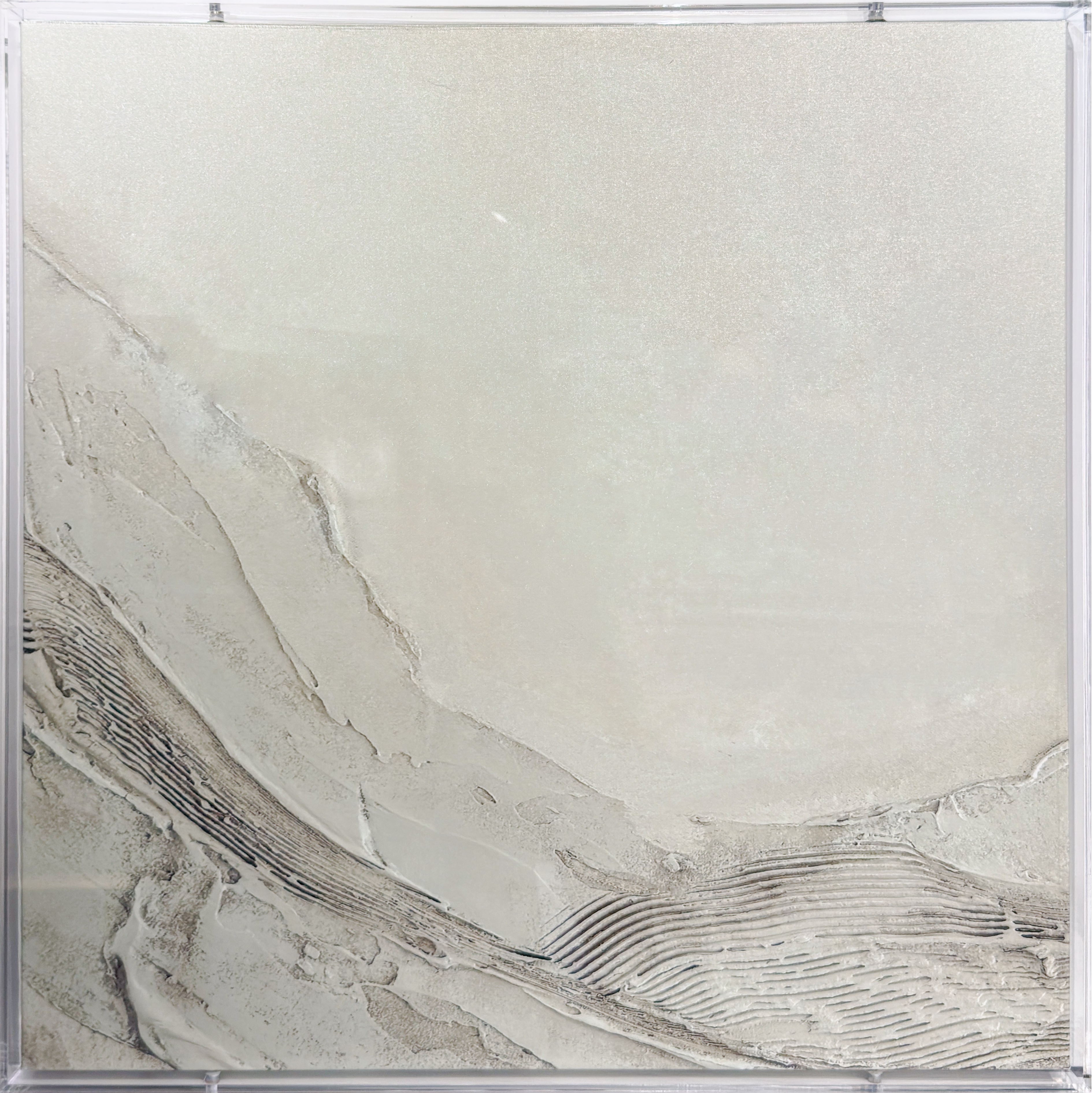 A refined study in texture and depth, Quiet Strata pairs archival canvas printing with a museum-grade acrylic shadowbox enclosure, creating a luminous, dimensional presentation that shifts subtly with changing light. The restrained palette and sculptural surface detail evoke natural geological forms, offering a sophisticated focal point designed for contemporary interiors.