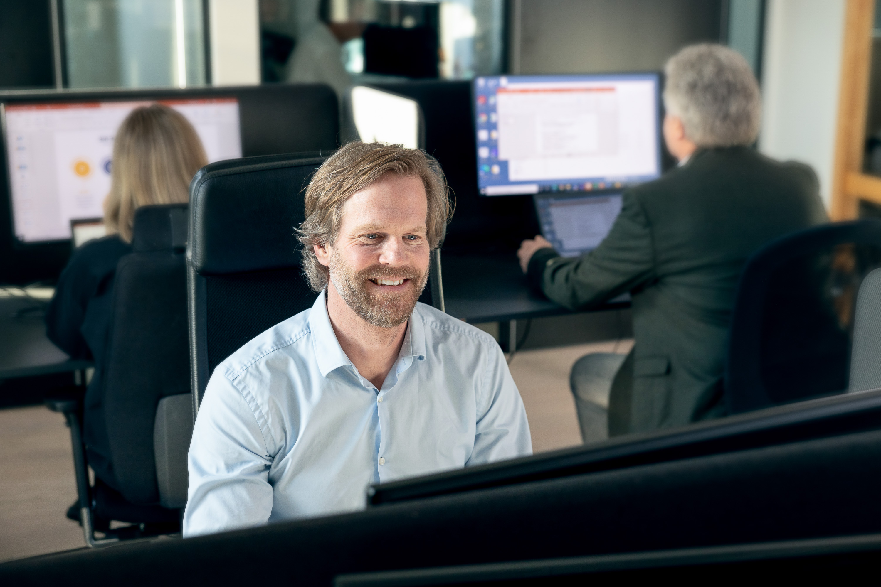Situasjonsbilde av ansatte i arbeid, bedriftsfotografering Oslo