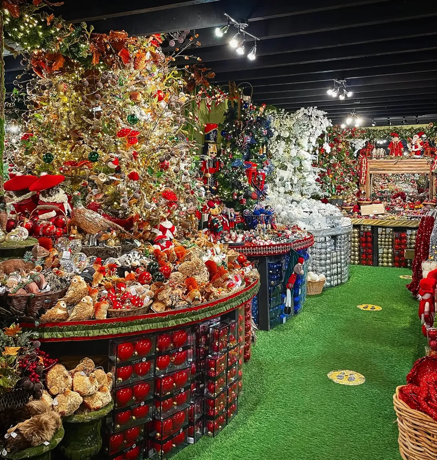 Inside the Christmas shop, with decorated trees and displays of baubles and ornaments