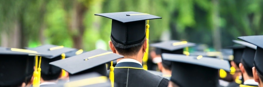Group of graduates in caps and gowns.