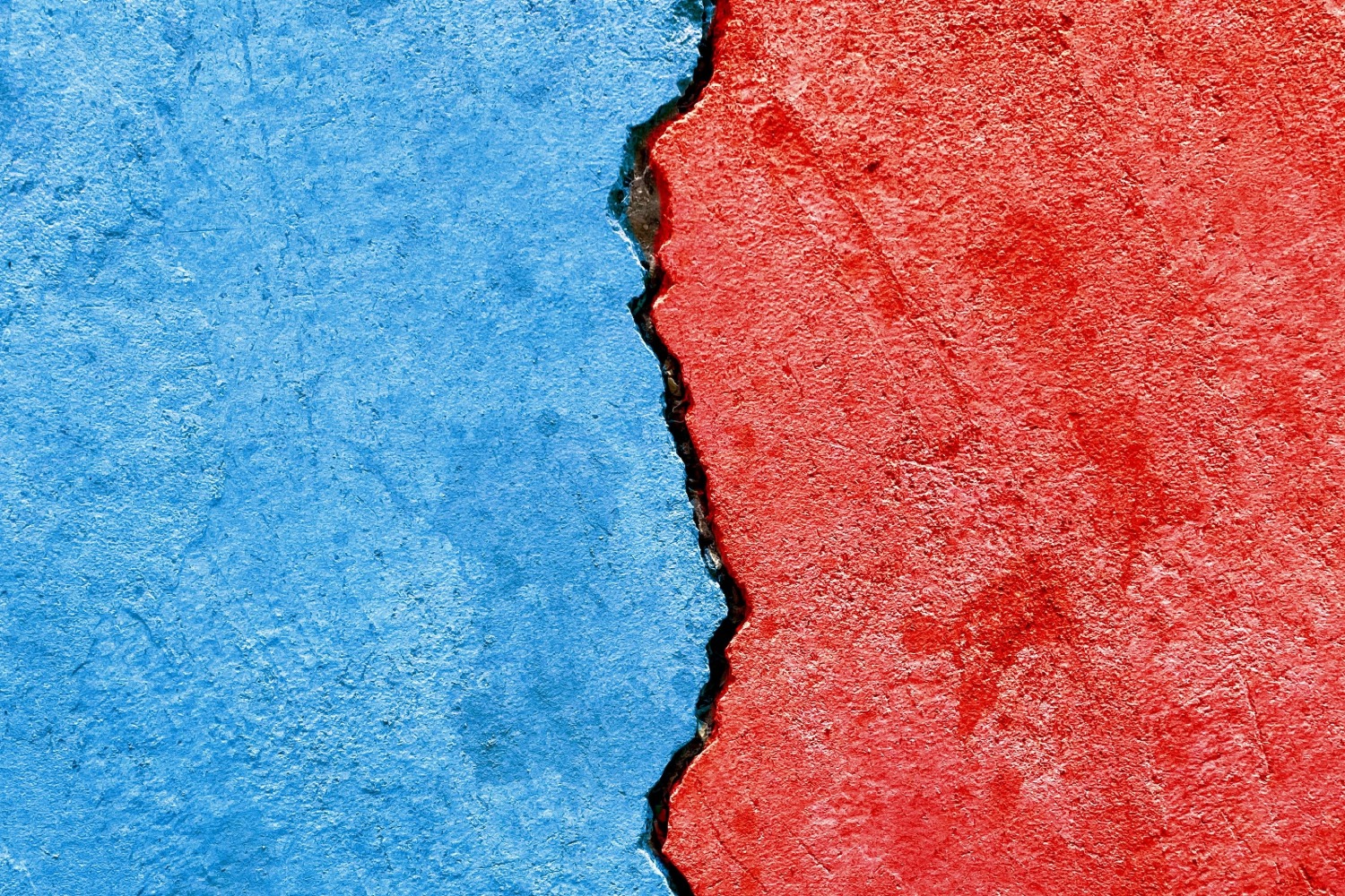 Cracked blue and red wall.