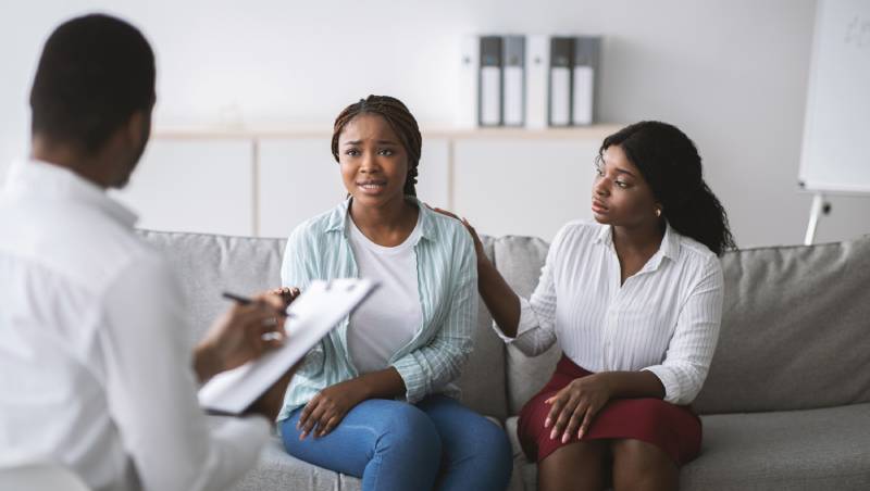 Two women in a counseling session.