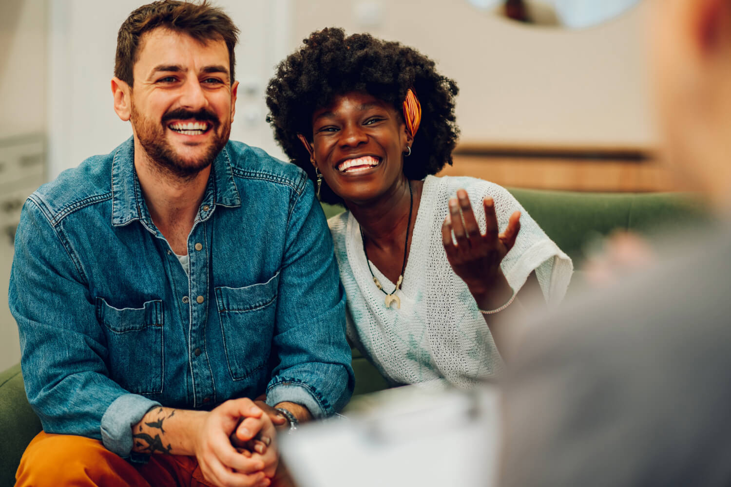 Smiling couple in therapy session.
