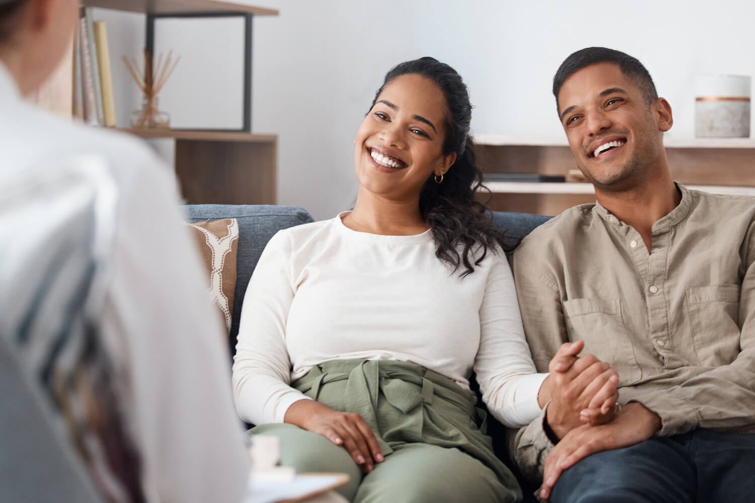 Smiling couple during therapy session.