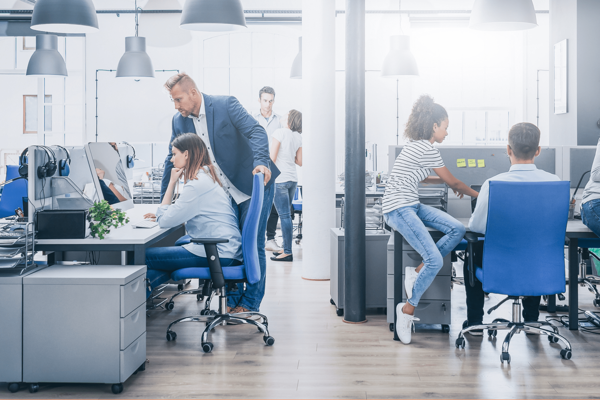 People in a modern open-plan office.