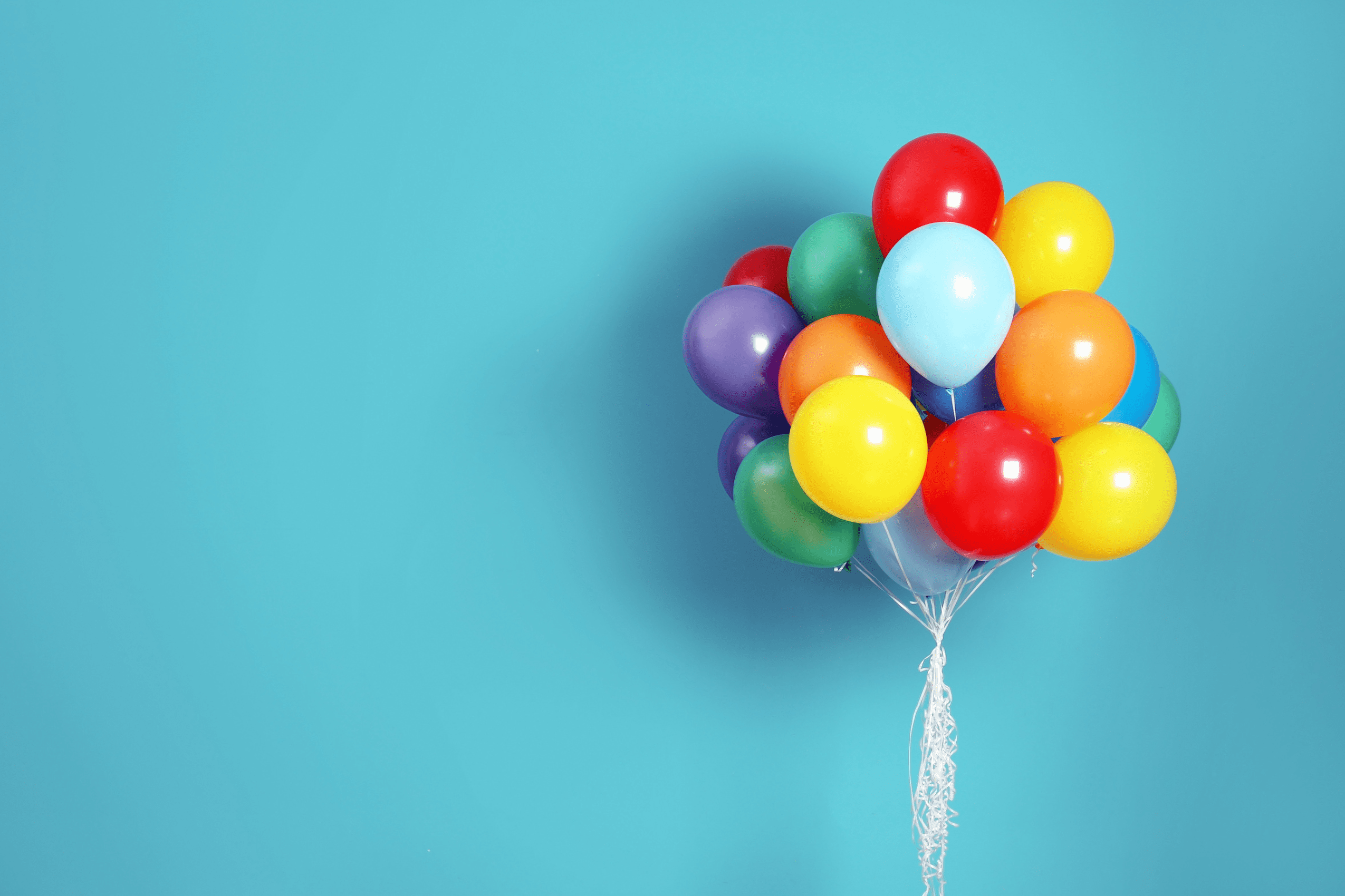 Colorful balloons against blue background