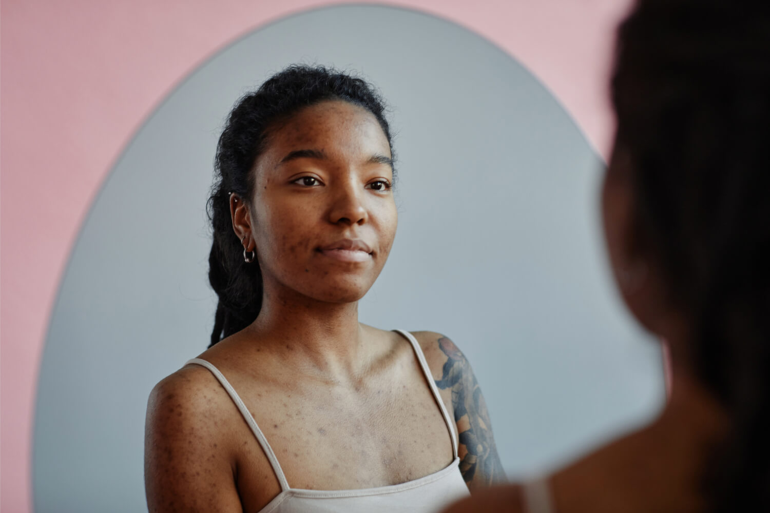 Woman looking into mirror