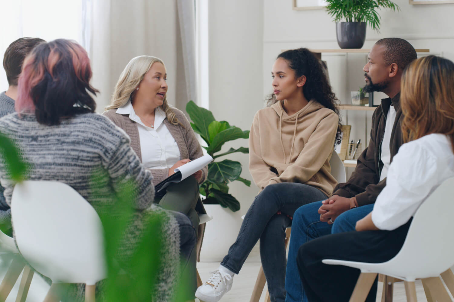 Diverse group in therapy session.