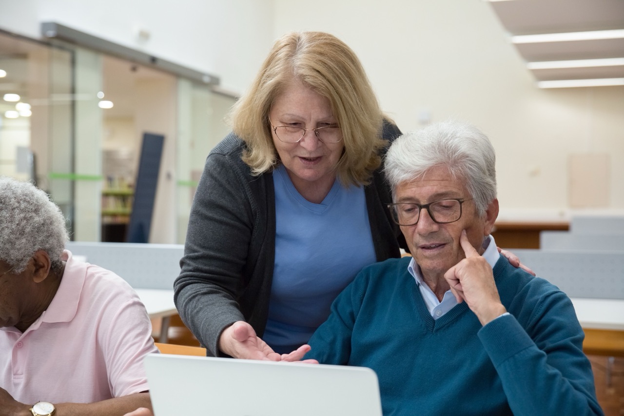 Senior citizens on a computer.