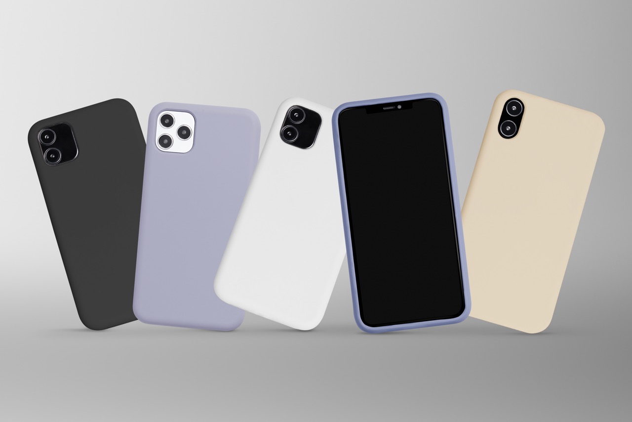 Five smartphones in different colors lined up side by side