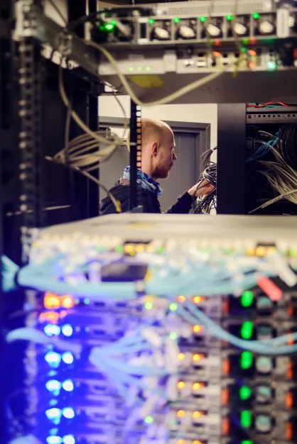engineer working in server room.