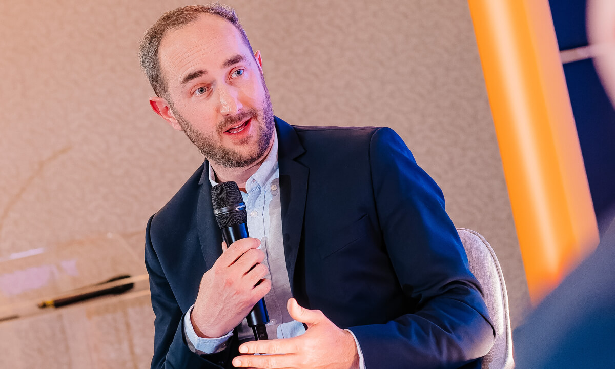 Guillaume Roux, Head of Business Development at Qover, speaking on stage at Insurtech Insights 2026