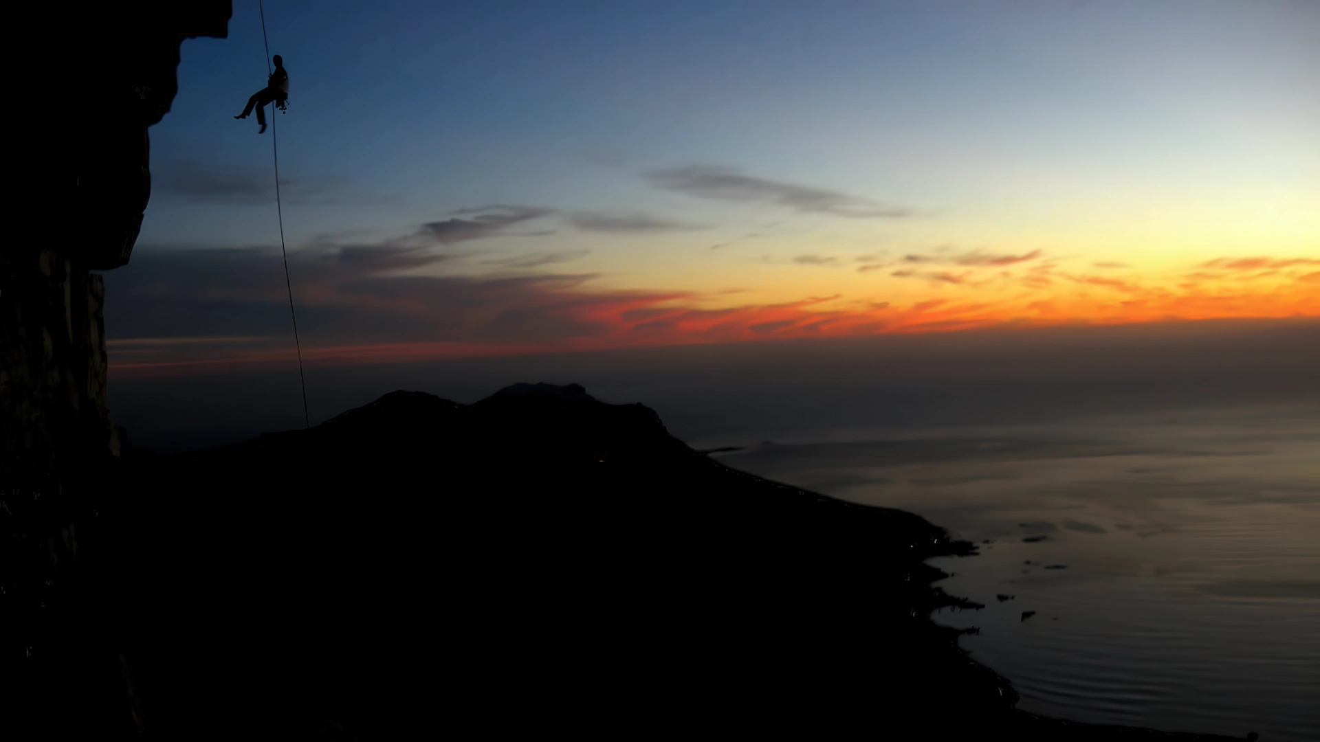 Abseiling off Table Mountain at Sunset