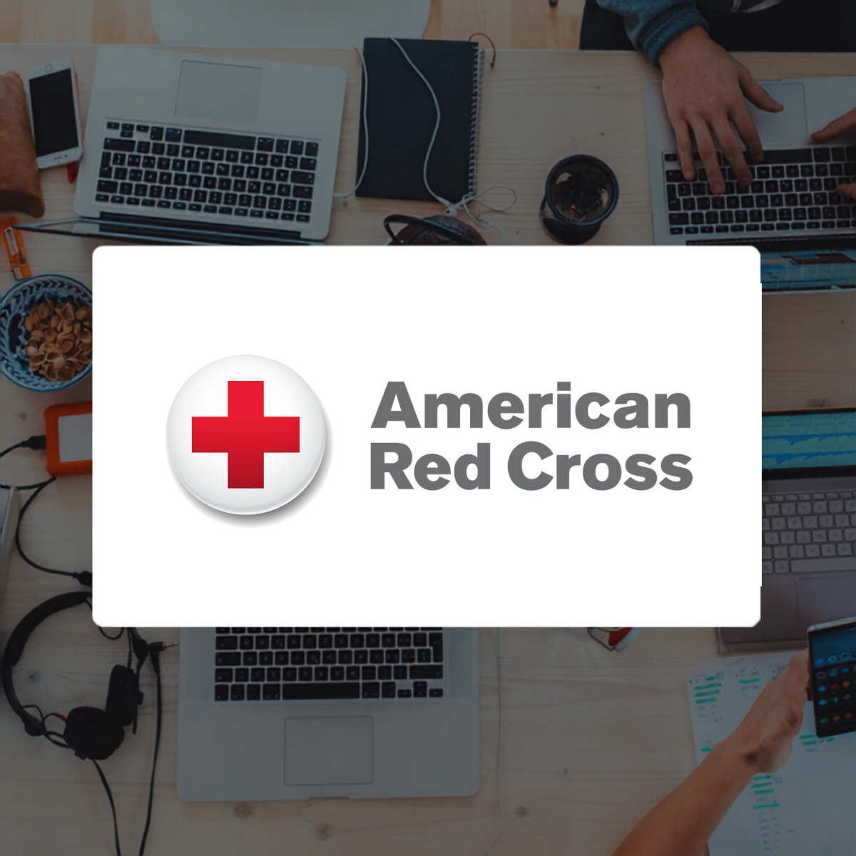 American Red Cross logo on background of laptops
