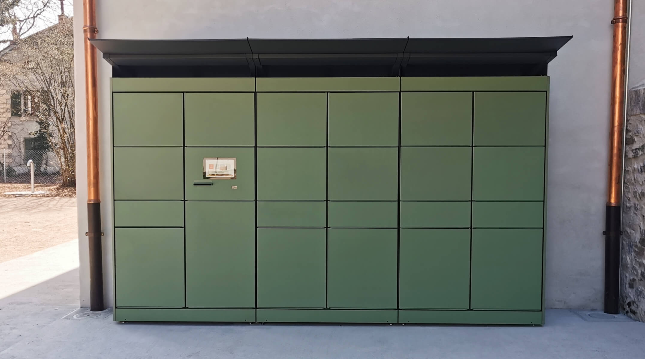 Compact locker footprint designed for plazas and transit-adjacent public space