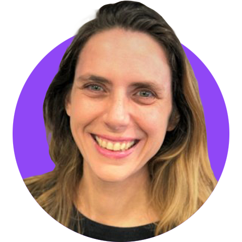 A headshot of a smiling long-haired woman wearing a polka-dot shirt edited within a simple circle graphic with a bright purple background.