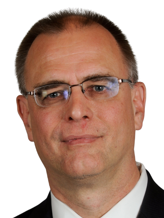 A headshot of a dark haired man wearing glasses in a suit edited within a simple circle graphic with a bright purple background.